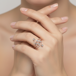 soft studio light image with female model wearing Miravyn ring. Make the ring appear smaller than it is.