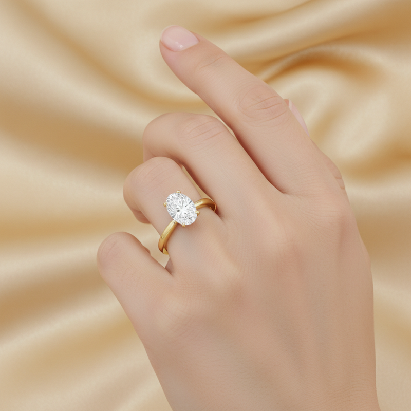 studio softlight model image on female model hand, wearing solitaire oval ring. The oval diamond is 10mm in length and 6.5mm in width. make the ring smaller than it is