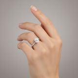 studio soft light image of ring on female model hand. Oval solitaire center stone. The oval center stone is only 10mm in length and 6mm in width. Make the ring smaller than it is