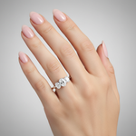 model female image on hand studio light with 3 oval stones. make the ring smaller than it is