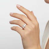 model female image on hand studio light with 3 oval stones. make the ring smaller than it is