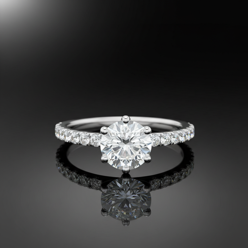 Design a detailed product showcase image of the Freya engagement ring laid flat on a reflective, glass surface with a glossy m backdrop. Use HDR studio lighting with a diffused key light to highlight the intricate prong setting, side diamonds, and the smoo