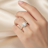 female hand model image, editorial setting scene. round halo diamond is 6mm. make the ring smaller than it is