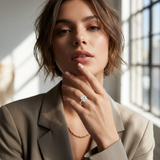 Close-up of Bayan 14K yellow gold radiant cut lab-grown diamond engagement ring with hidden halo