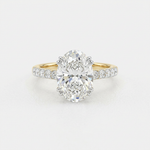 Front top view of Isidora 14K yellow gold oval lab-grown diamond engagement ring with hidden halo on white background.
