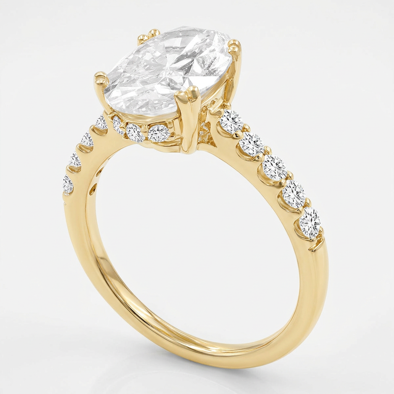Slant view of yellow gold Isidora engagement ring with lab grown diamond, white background.