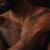 Detailed close-up of a 24-inch Italian-made 925 sterling silver diamond-cut cable chain necklace on skin.