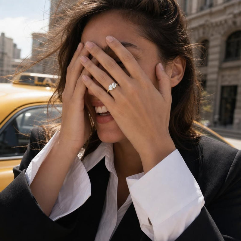 Elegant Toi et Moi ring with two 1 ct pear-shaped lab-grown diamonds set in 14K yellow gold, showcasing modern sophistication and timeless style.
